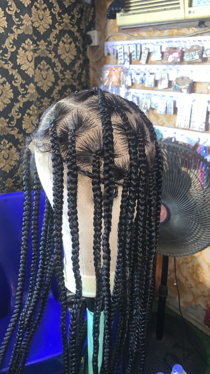 Layered hair braiding installation in progress